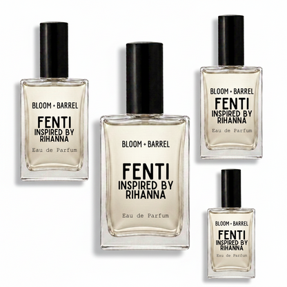 Four clear glass perfume bottles with black caps arranged on a white background. The center bottle is largest, with three smaller identical bottles around it.