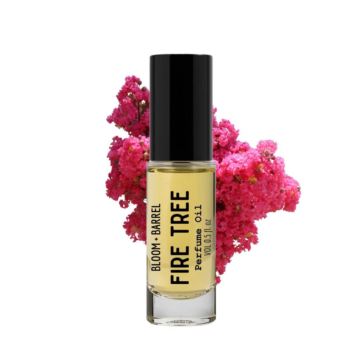 Perfume bottle labeled 'Fire Tree' with pink flowers in the background