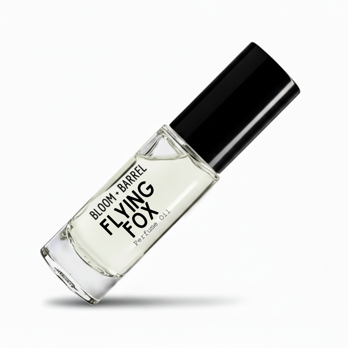 A clear glass perfume oil bottle with a black cap, labeled 'BLOOM + BARREL flying fox Perfume Oil', shown on a clean white background with a soft shadow.