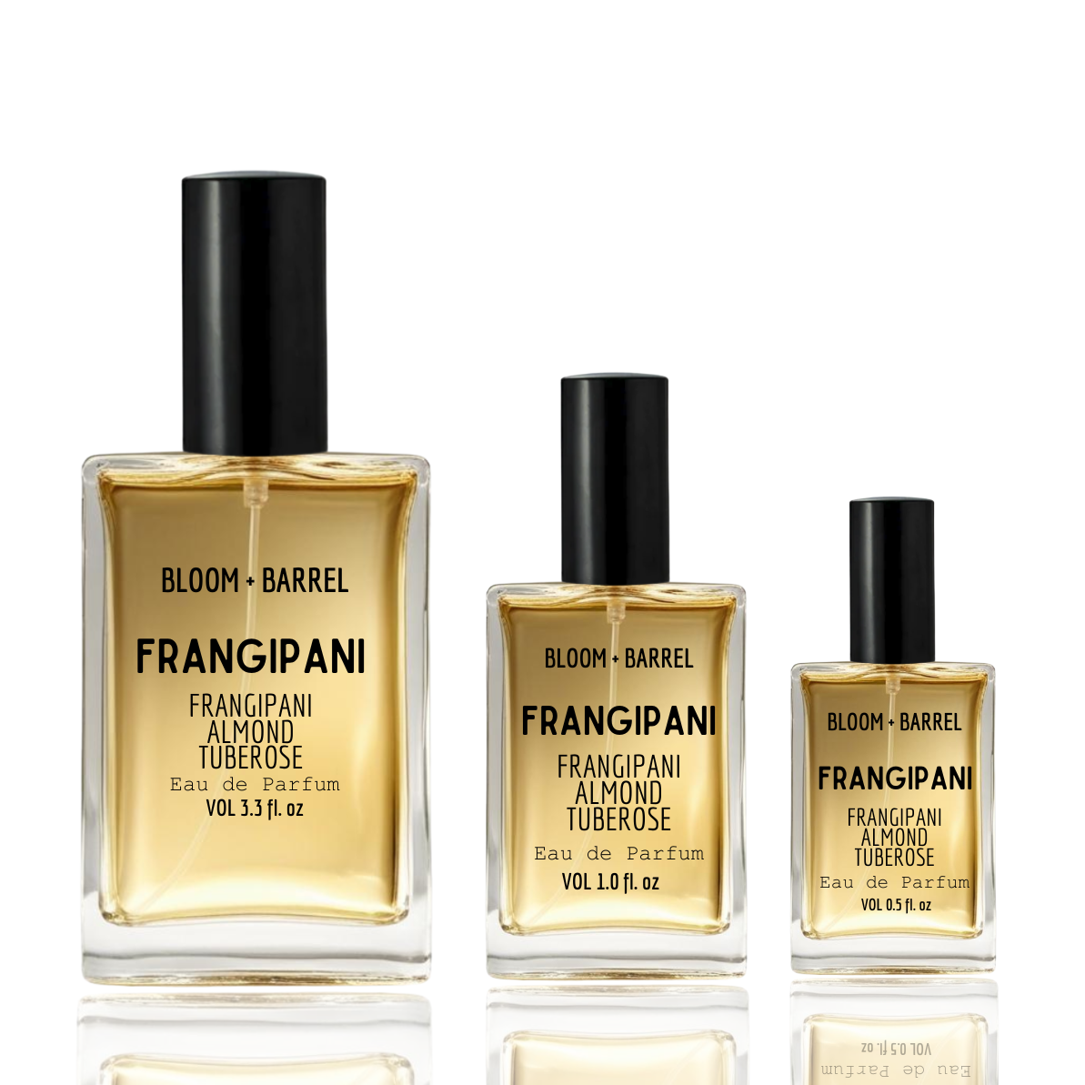 Three bottles of Bloom + Barrel Frangipani Almond Tuberose perfume on a white background