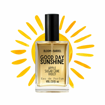 Perfume bottle labeled 'Good Day Sunshine' with a sun graphic in the background
