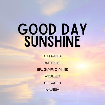 Text 'GOOD DAY SUNSHINE' with a list of scents against a colorful sky background.