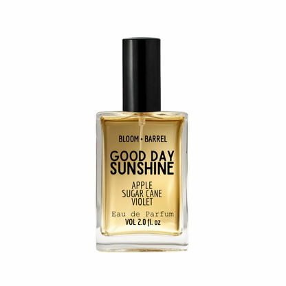 Perfume bottle labeled 'good day sunshine' by Bloom & Barrel on a white background