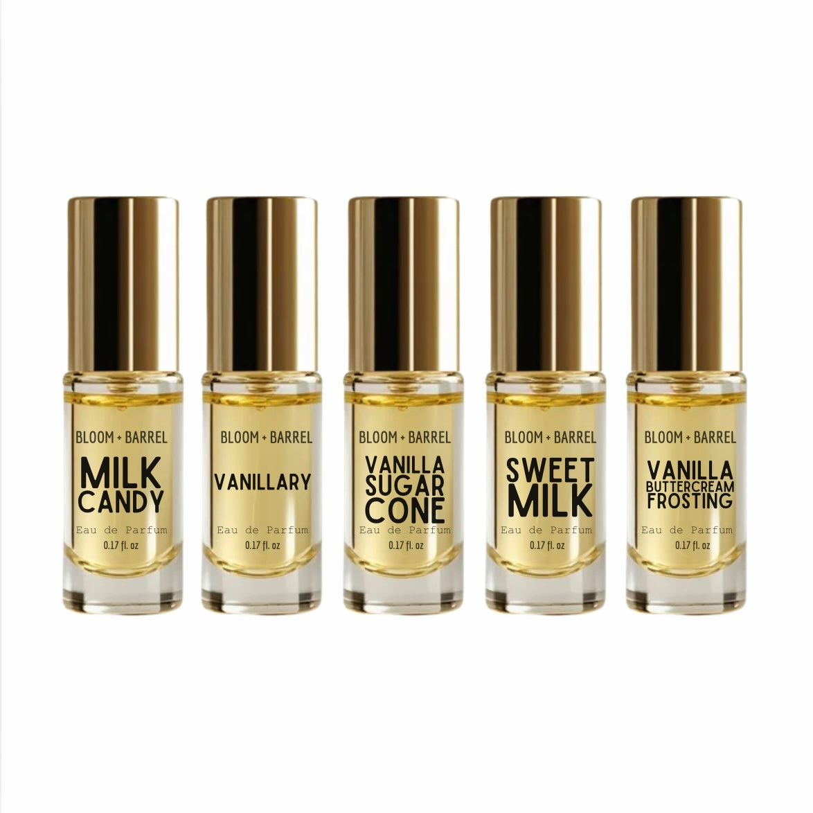 Five small cylindrical perfume bottles with shiny gold caps arranged in a row on a white background. The labels read Bloom + Barrel and the scents: Milk Candy, Vanilliy, Vanilla Sugar Cone, Sweet Milk, and Vanilla Buttercream Frosting.