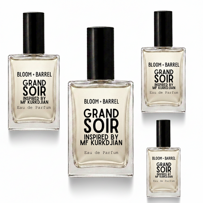 Four glass bottles of Bloom + Barrel Grand Soir Eau de Parfum inspired by Mr. Kurkdjian, arranged on a plain white background.
