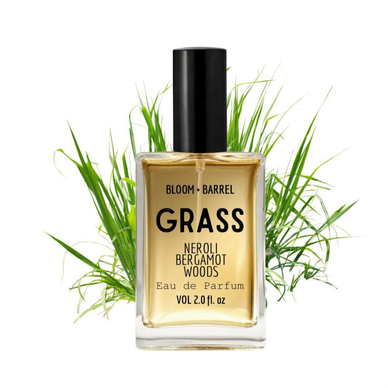 Perfume bottle labeled 'Grass' with grass elements on a white background