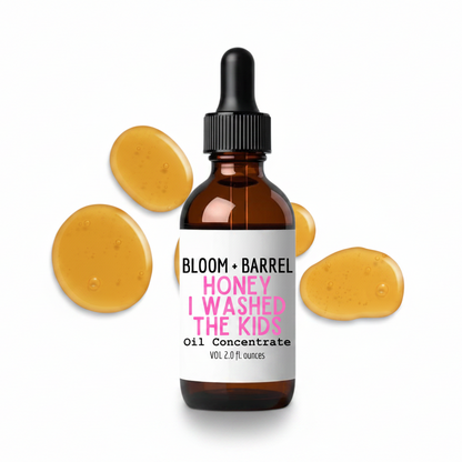 Bottle of 'Bloom + Barrel Honey I Washed the Kids' oil concentrate with dropper on a white background.