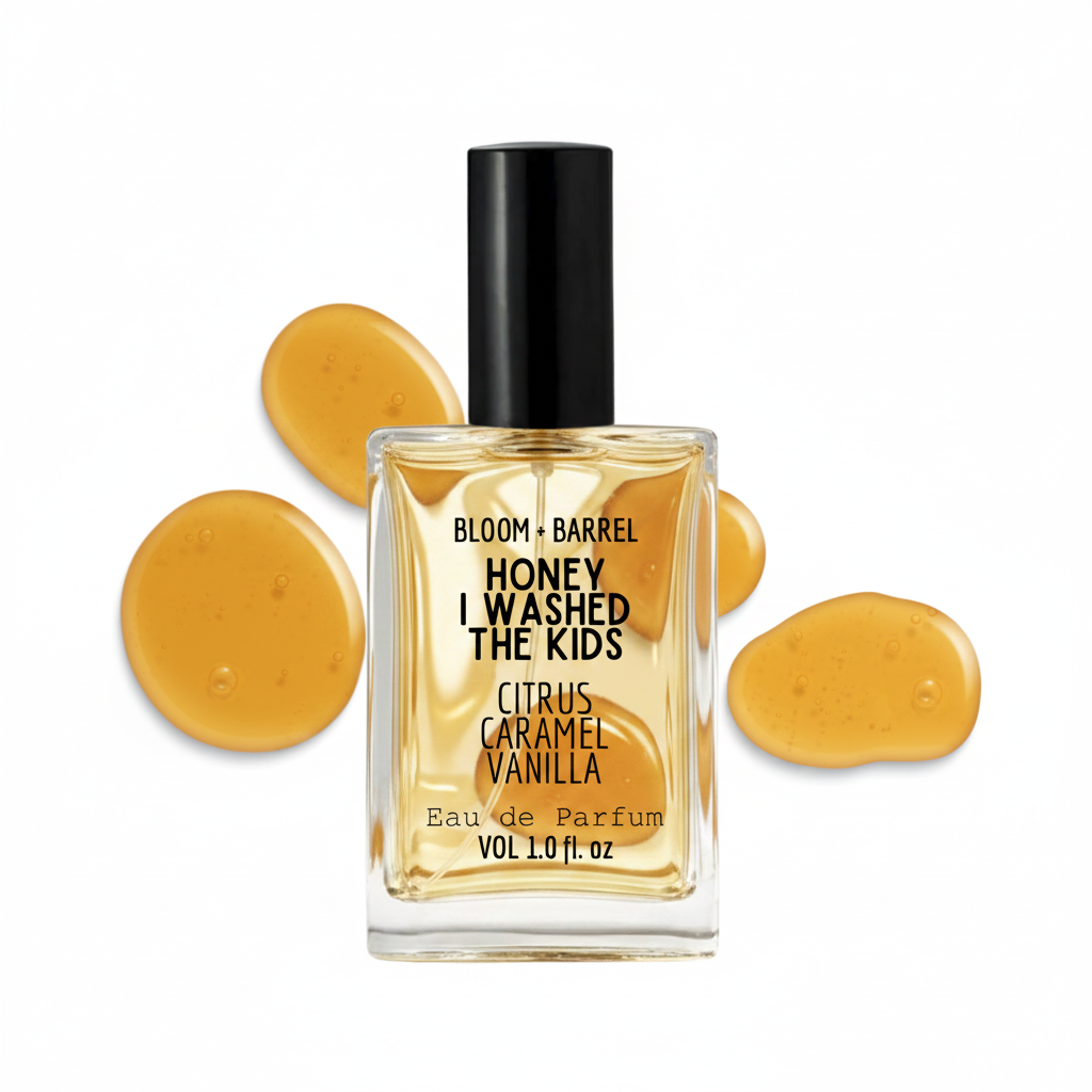 Perfume bottle labeled 'Honey I Washed the Kids' with yellow droplets on a white background