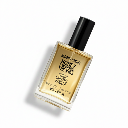 Perfume bottle labeled 'Honey I Washed the Kids' by Bloom & Barrel on a white background