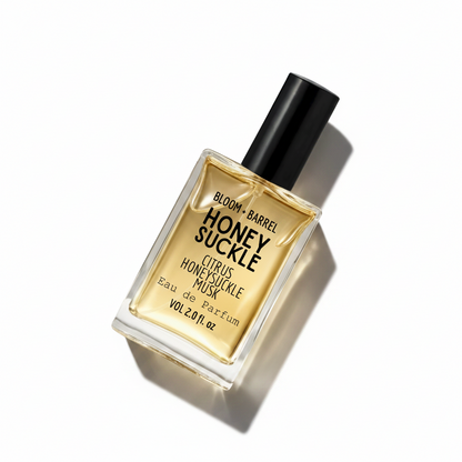 Perfume bottle labeled 'Honey Suckle' by Bloom & Barrel on a white background