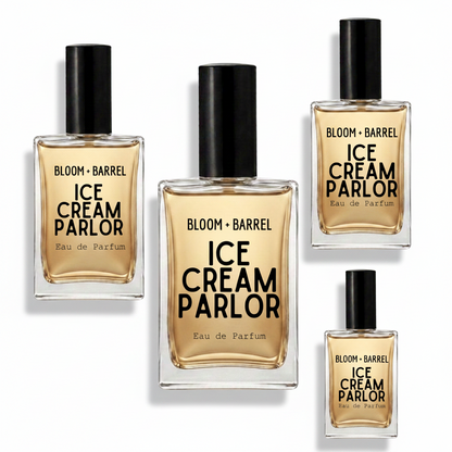 Four bottles of BLOOM + BARREL Ice Cream Parlor Eau de Parfum arranged on a plain white background, with varying bottle sizes but consistent black caps and amber-gold liquid.