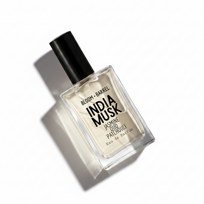 A rectangular glass bottle of Bloom + Barrel India Musk Eau de Parfum with a black cap, set against a plain white background.