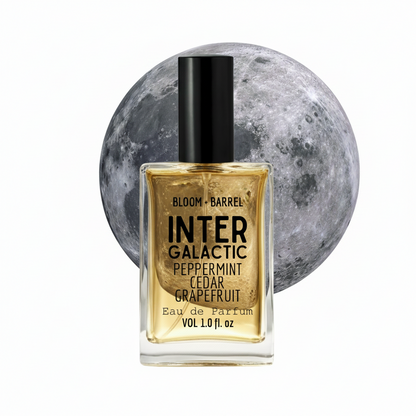 Perfume bottle labeled 'InterGalactic' with a moon in the background