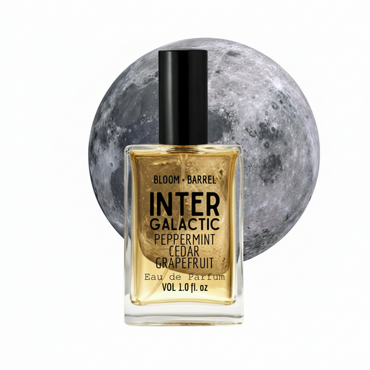 Perfume bottle labeled 'InterGalactic' with a moon in the background
