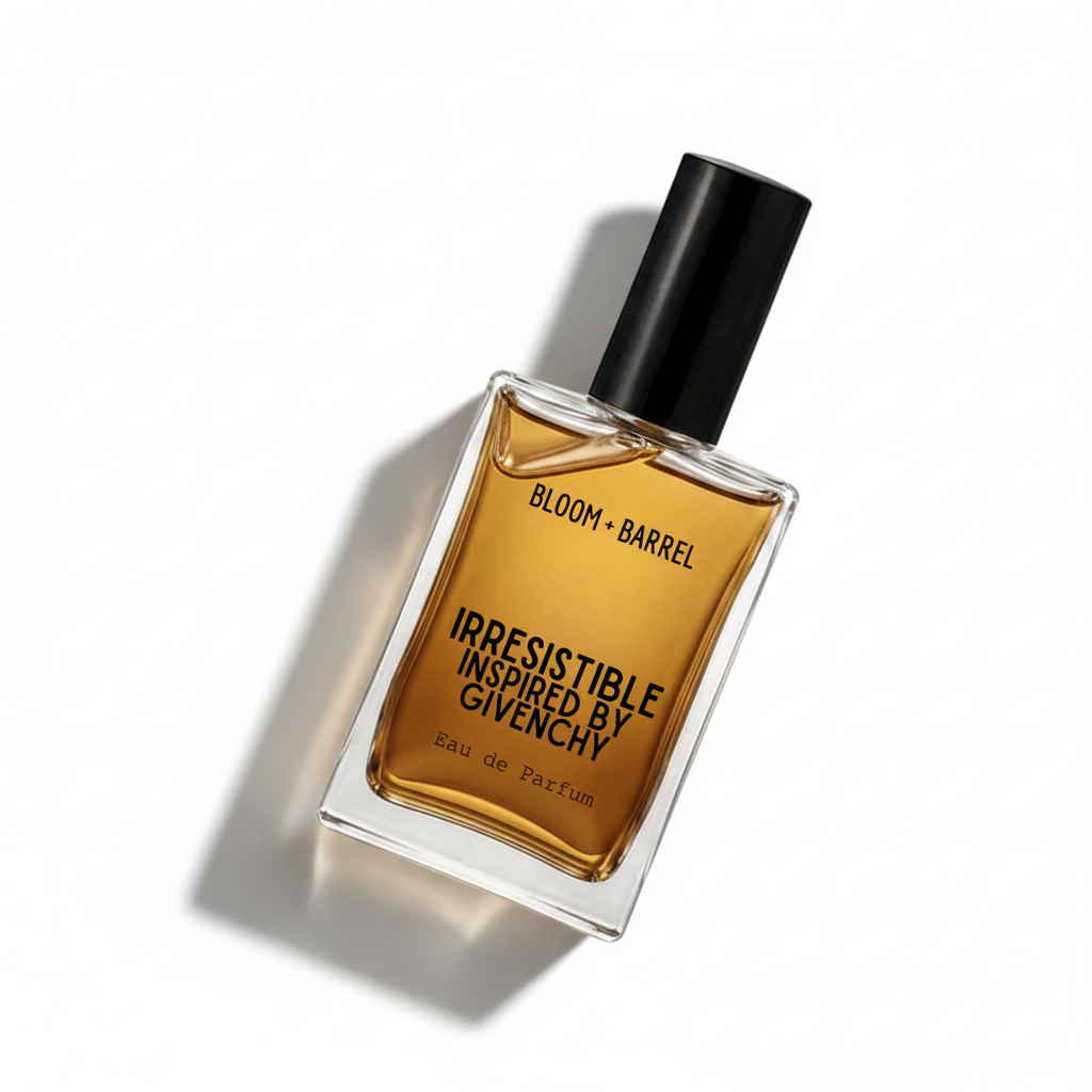 A rectangular glass bottle of Givenchy Bloom + Barrel Irresistible Eau de Parfum with amber-colored liquid, a black cap, and black lettering on a white background.