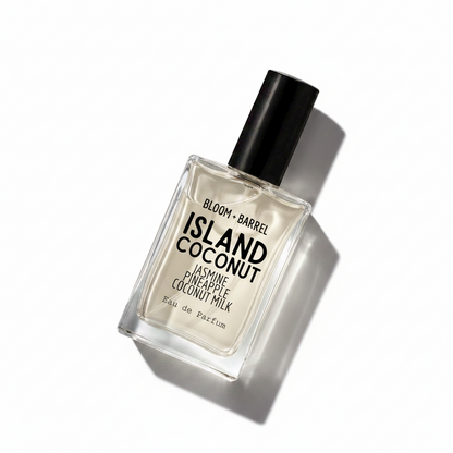 Bloom Barrel Island Coconut Eau de Parfum in a clear rectangular glass bottle with a black cap, on a plain white background.