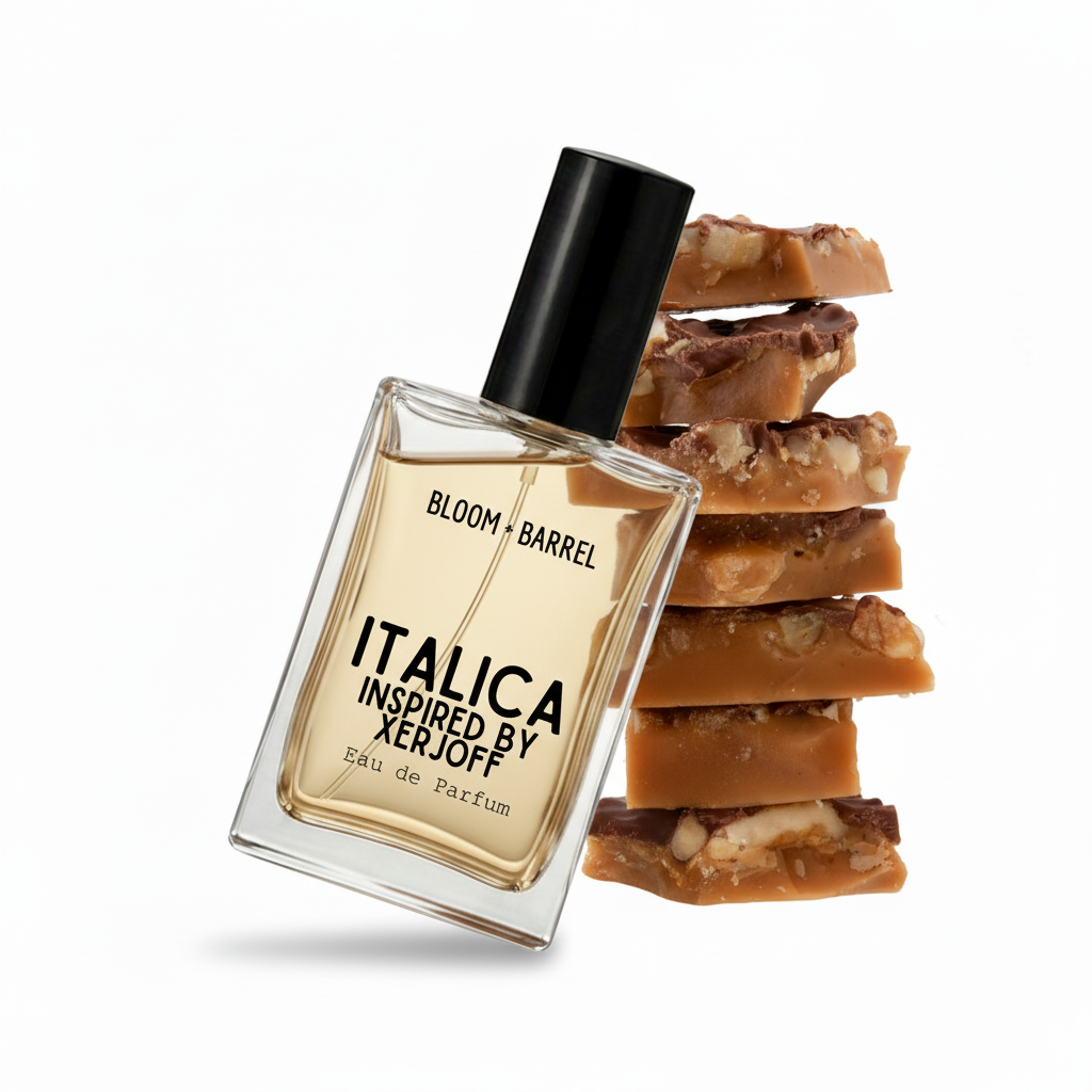 A clear rectangular perfume bottle with a black cap and amber-gold liquid, labeled 'ITALICA INSPIRED BY XERJOFF' and 'BLOOM • BARREL', shown in front of stacked caramel and cookie pieces on a white background.