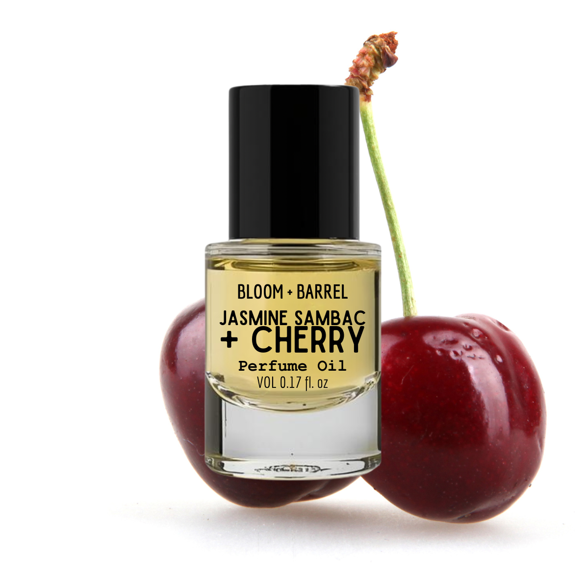 Perfume oil bottle labeled 'Bloom + Barrel Jasmine Sambac + Cherry' with two cherries on a white background