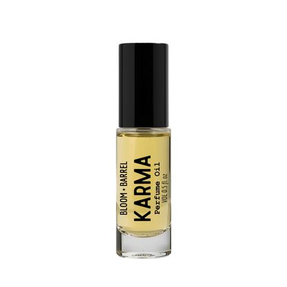 Perfume bottle labeled 'Karma' by 'Bloom & Barrel' on a white background