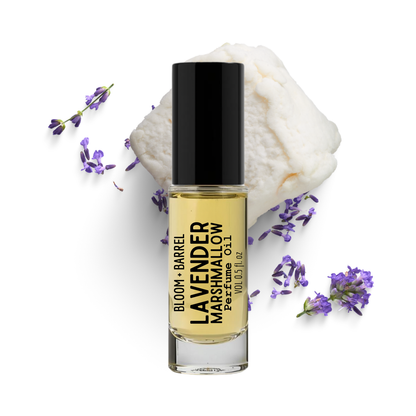 Bottle of Lavender Barrel Marshmallow perfume with lavender flowers on a white background