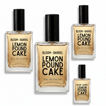 Four bottles of BLOOM + BARREL Lemon Pound Cake Eau de Parfum arranged on a plain white background, with the central bottle largest and the others smaller.