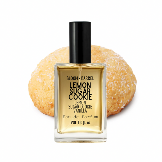 Perfume bottle labeled 'Lemon Sugar Cookie' with a cookie in the background