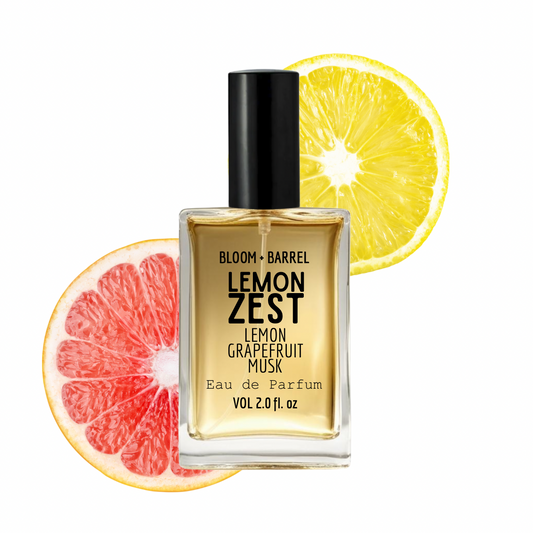 Bottle of 'Lemon Zest' perfume with lemon and grapefruit slices on a white background