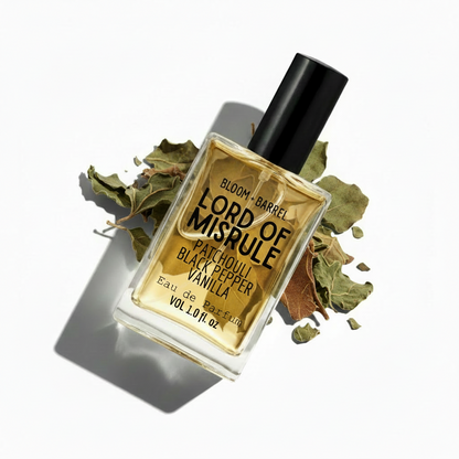 Perfume bottle labeled 'Lord of Misrule' with leaves on a white background