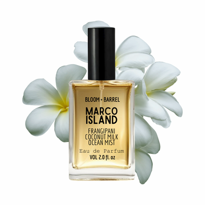 Perfume bottle labeled 'Marco Island' with white flowers on a white background
