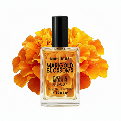 Perfume bottle labeled 'Marigold Blossoms' with marigold flowers on a white background