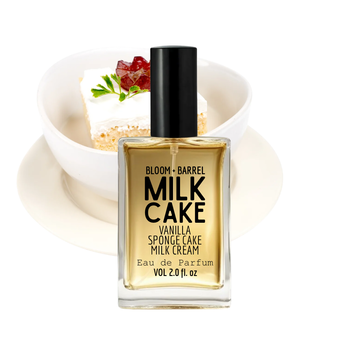 Bloom + Barrel Milk Cake Vanilla Sponge Cake Milk Cream Eau de Parfum in a clear rectangular bottle with a black cap, shown in front of a dessert bowl on a white plate against a white background.