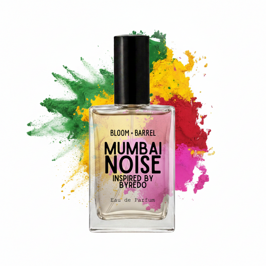 A bottle of Mumbai Noise Eau de Parfum by Byredo, featuring a clear glass bottle with a black cap and golden-amber liquid, set against a white background with a colorful paint splatter graphic.