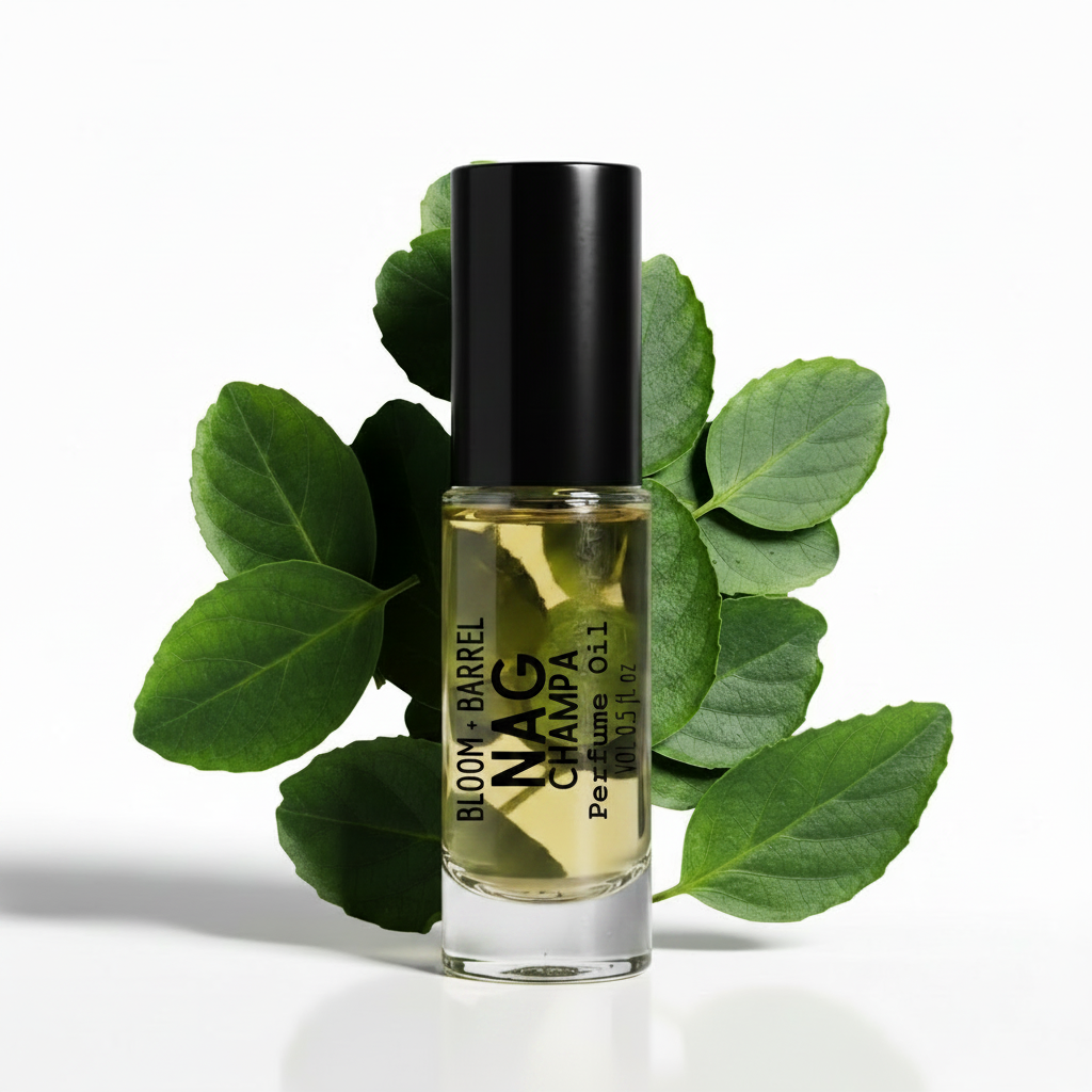Perfume bottle with green leaves on a white background
