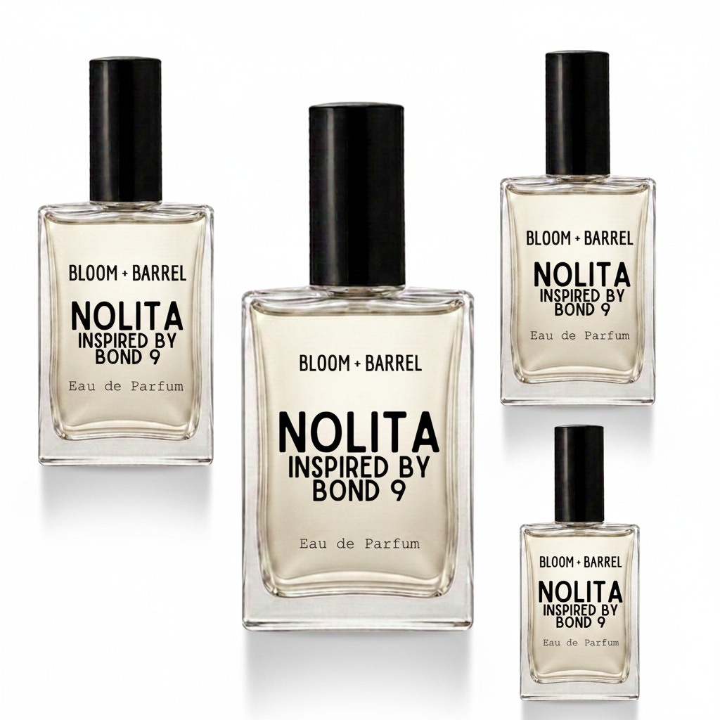 Four clear glass perfume bottles with black caps arranged on a white background. The center bottle is largest, with three smaller matching bottles around it.