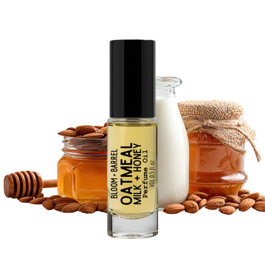 Bloom & Barrel Oatmeal, Milk, and Honey perfume bottle with jars of honey and almonds on a white background