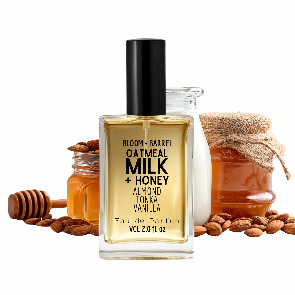 Perfume bottle labeled 'Bloom + Barrel' with honey jars, almonds, and a honey dipper on a white background