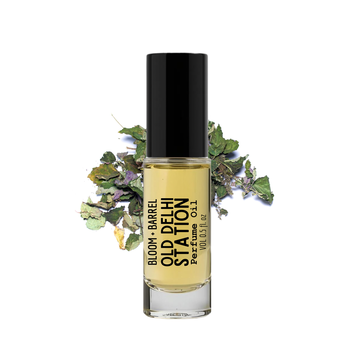 Perfume bottle labeled 'Old Delhi Station' with green leaves on a white background