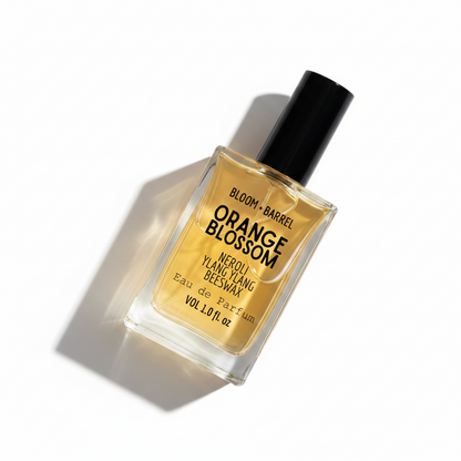 Perfume bottle labeled 'Orange Blossom' by Bloom & Barrel on a white background