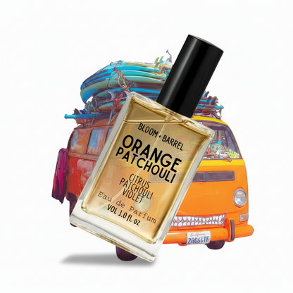 Perfume bottle labeled 'Orange Patchouli' with a colorful van-shaped object in the background