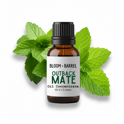 Bottle of Bloom & Barrel Outback Mate Oil Concentrate with mint leaves on a white background