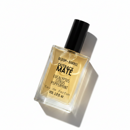 Perfume bottle labeled 'Outback Mate' by Bloom & Barrel on a white background