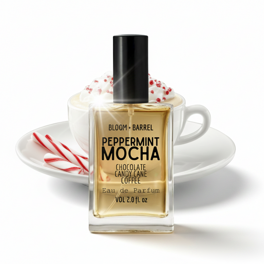 Bottle of Bloom & Barrel Peppermint Mocha Eau de Parfum with a cup and candy canes in the background.