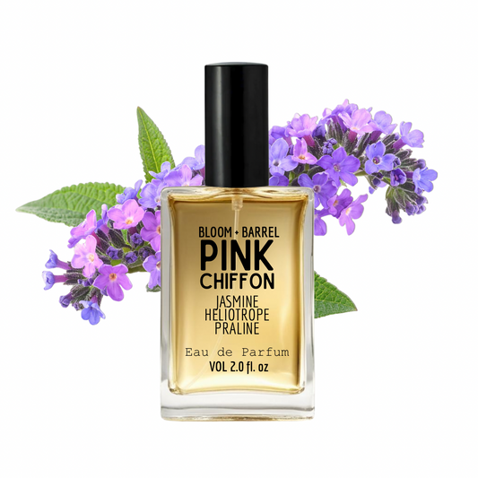 Perfume bottle labeled 'Pink Chiffon' with purple flowers and green leaves on a white background