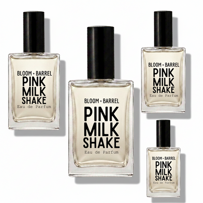 Four glass bottles of BLOOM + BARREL Pink Milk Shake Eau de Parfum with black caps, arranged on a plain white background.