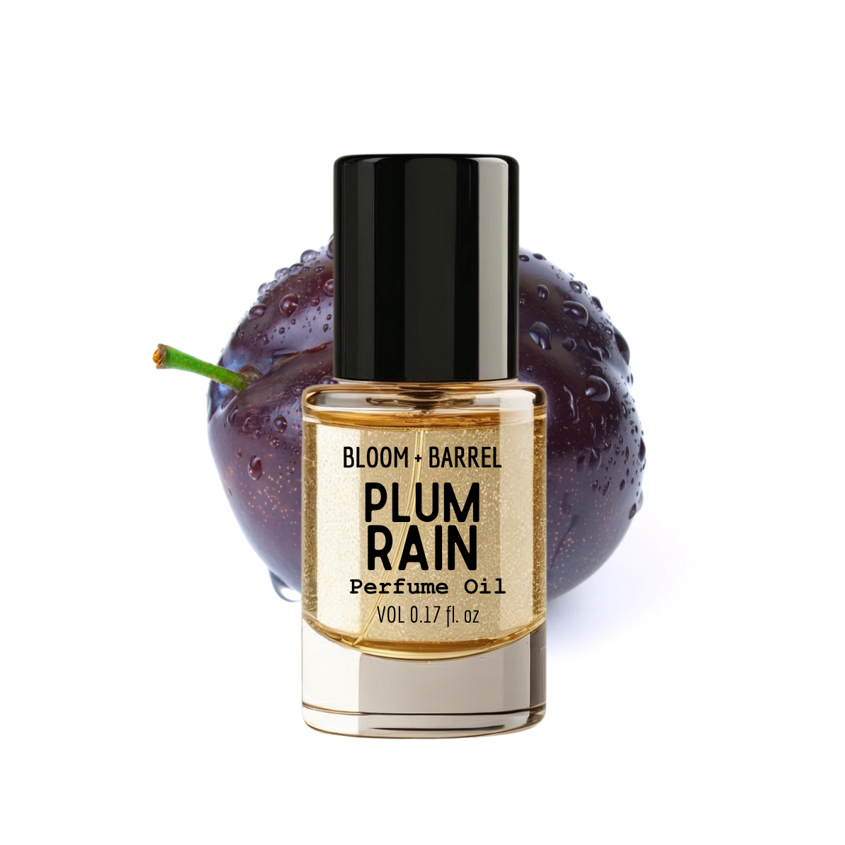 Bottle of Bloom & Barrel Plum Rain Perfume Oil with a plum fruit on a white background