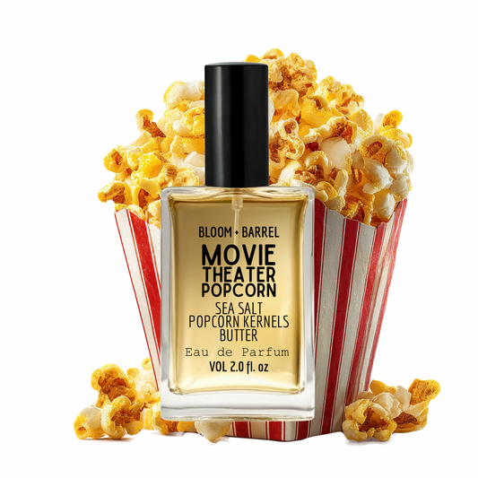 Bloom + Barrel Movie Theater Popcorn Eau de Parfum bottle in front of a red-and-white striped popcorn bucket filled with popcorn, on a white background.