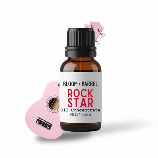 Bottle of Bloom & Barrel Rock Star Oil Concentrate with a small pink guitar on a white background