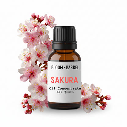 Bottle of Bloom & Barrel Sakura oil concentrate with cherry blossoms on a white background