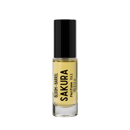 Perfume bottle labeled 'Sakura' by 'Bloom & Barrel' on a white background