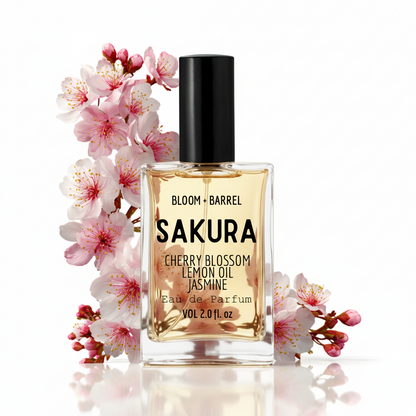Bottle of Sakura Eau de Parfum with cherry blossoms on a white background